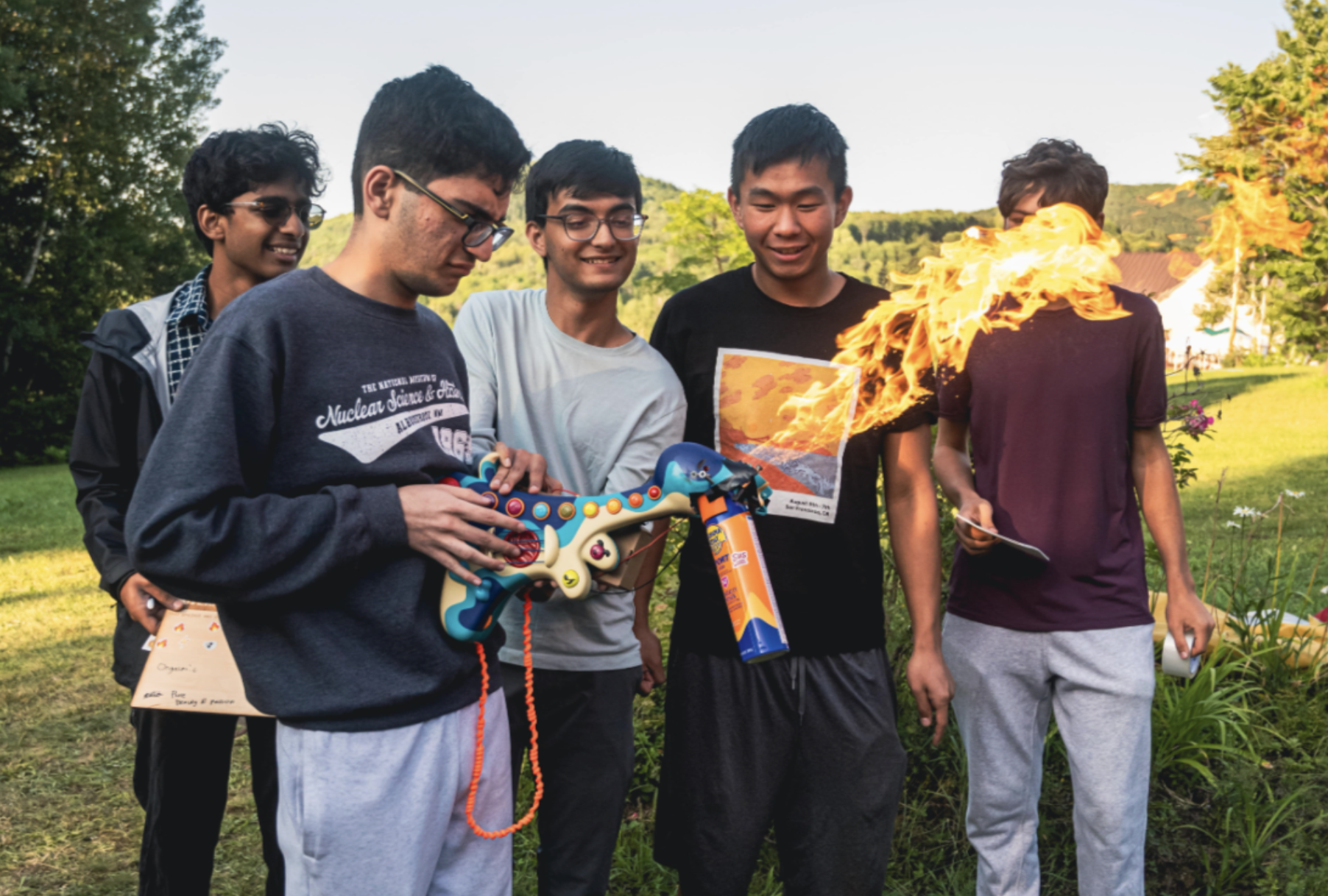 Students demonstrating a flame thrower at Outernet